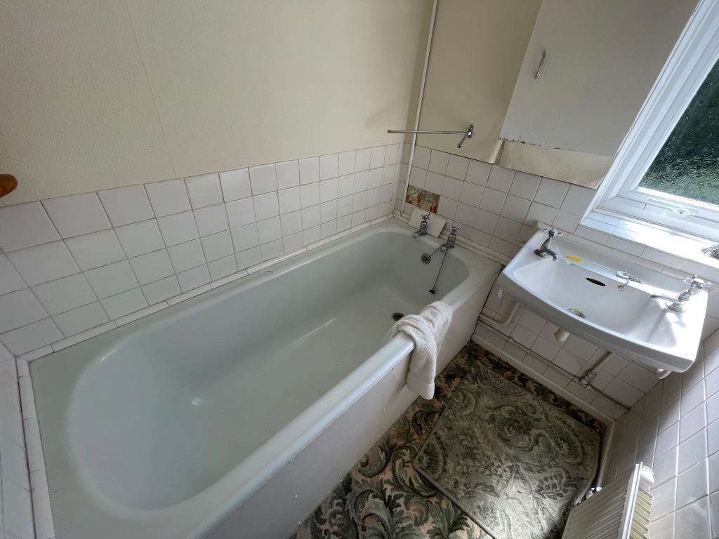 Lot: 11 - SEMI-DETACHED HOUSE FOR IMPROVEMENT AND REPAIR - Bathroom with panel bath and wash hand basin